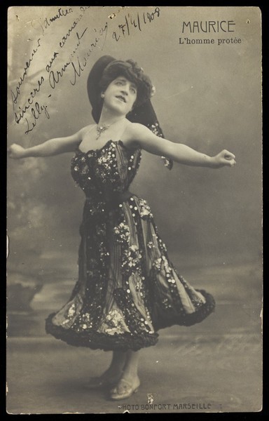 Download the full-sized image of An actor in drag, known as "Maurice"; poses on stage mid-dance. Photographic postcard, 1908.