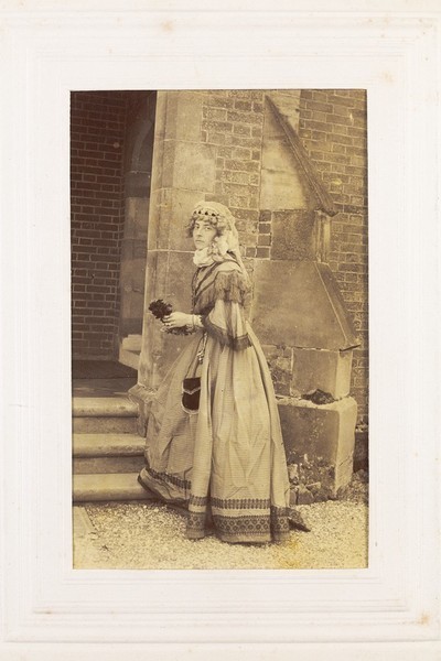 Download the full-sized image of A man in drag posing in historical costume. Photograph, 189-.