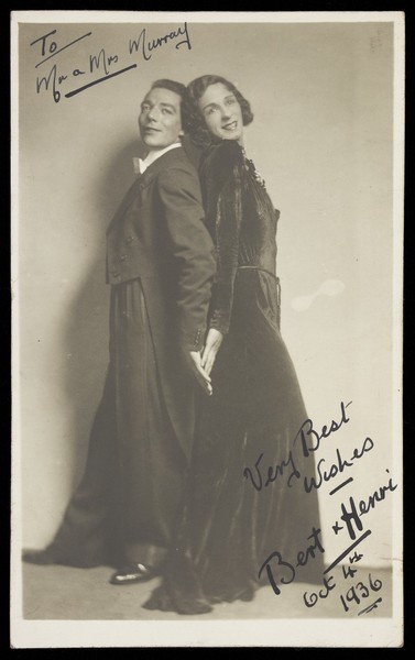 Download the full-sized image of Bert and Henri, in character; wearing evening dress, one of them in drag. Photographic postcard, 1936.