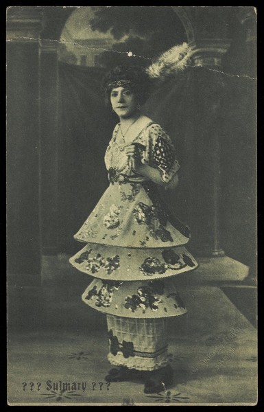 Download the full-sized image of An actor in drag poses on stage as "Sulmary". Process print, ca. 1910.