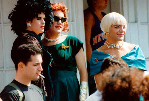 Download the full-sized image of Wigstock Participants in Black-feathered Hat, Red and Platinum Blonde Wigs