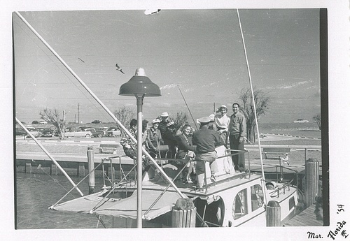 Download the full-sized image of Christine Jorgensen Surrounded by Eight People On Top of a Boat