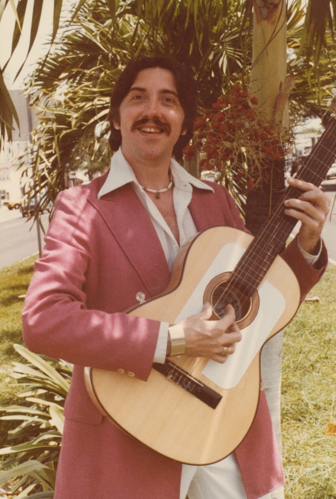 Download the full-sized image of A Photograph of Guillermo Knight Playing Guitar