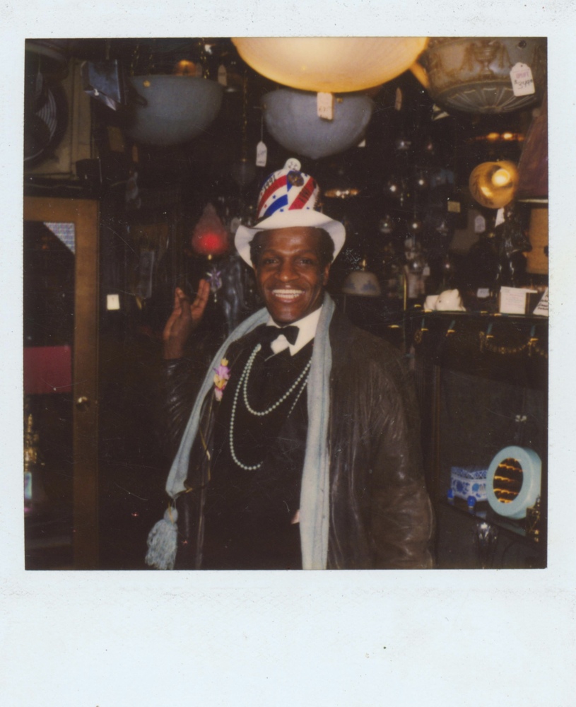 Download the full-sized image of A Photograph of Marsha P. Johnson Wearing a USA Flag Hat and Formalwear