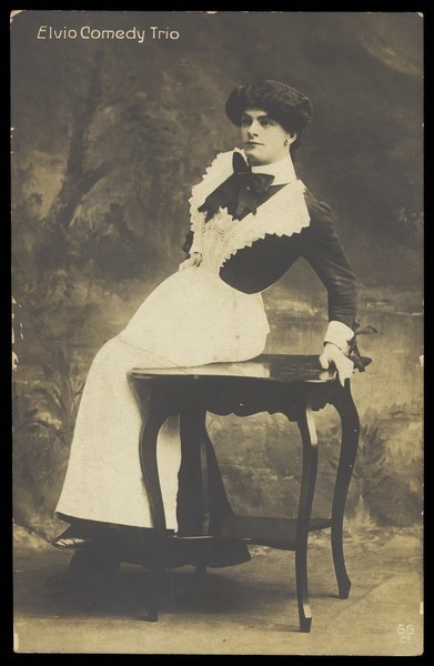 Download the full-sized image of A member of the Elvio Comedy Trio in drag. Photographic postcard, ca. 1905-1910.