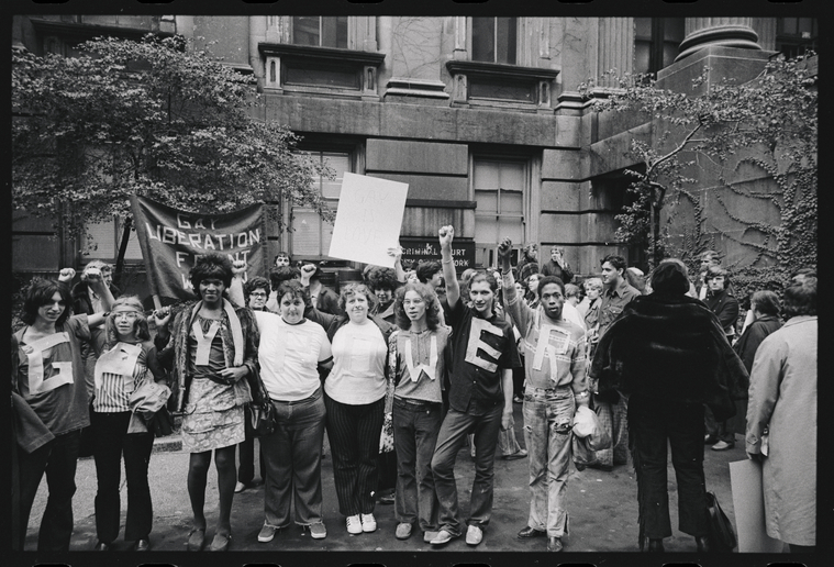 Download the full-sized image of A Photograph Featuring Marsha P. Johnson, Sylvia Rivera, and other Gay Liberation Front Members Holding Up Their Fists at New York City Hall