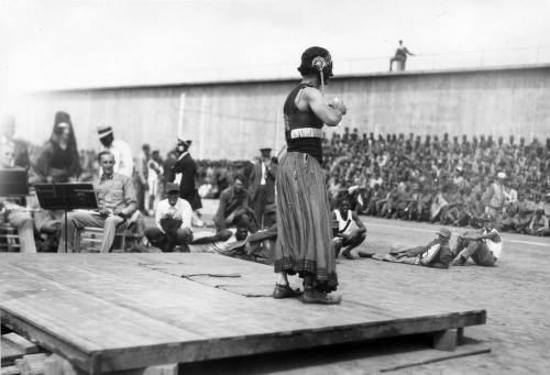 Download the full-sized image of Stage entertainment, featuring a male dancer in female dress, San Quentin Little Olympics Field Meet, 1930 