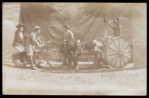 Download the full-sized image of Four British servicemen performing a sketch with vehicles. Photograph, 191-.