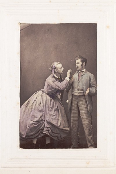 Download the full-sized image of Two men, one in drag, posing in disagreement. Photograph, 189-.