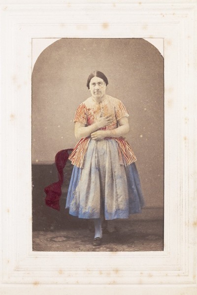 Download the full-sized image of A man in drag posing while rolling his eyes. Process print, 189-.