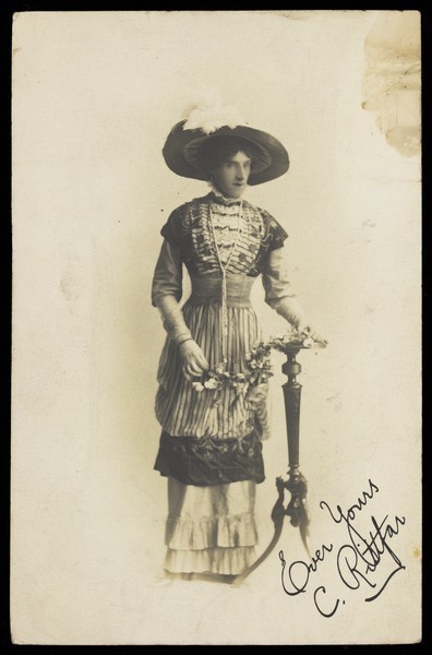 Download the full-sized image of C. Rittfar, a man in drag, wearing an elaborate hat and dress. Process print, 191-.