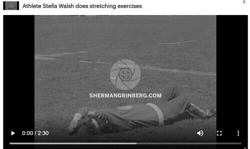 Download the full-sized image of Athlete Stella Walsh does stretching exercises